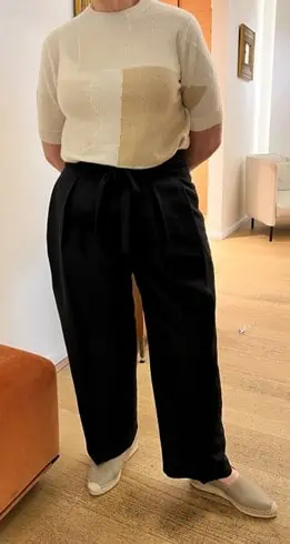 client wearing black pants and essential style pieces