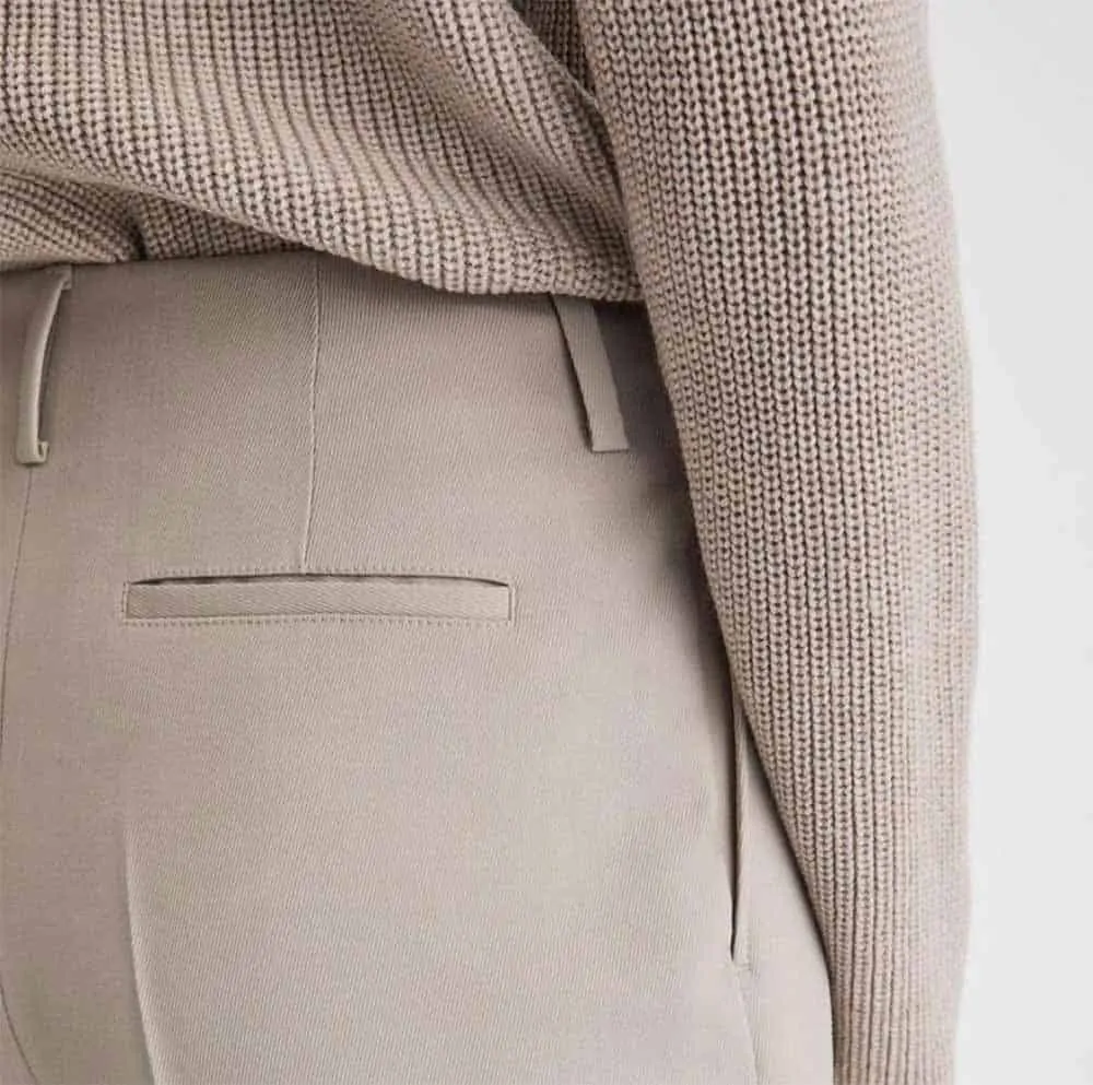 cream sweater and cream pants with back pocket