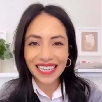 Next Level Wardrobe's Cassandra Sethi Wearing A Collared Shirt As An Example Of How To Dress When Giving A Virtual Presentation