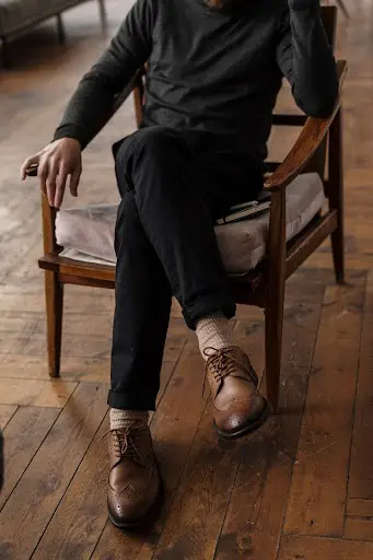 Man In Chair Wearing Oxford Business Casual Shoes