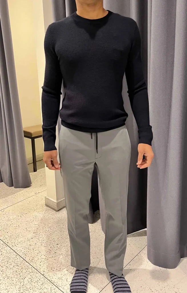 Paul trying out an updated approach to men’s business casual style. Featuring a tech pant and well-fitted crew-neck sweater.