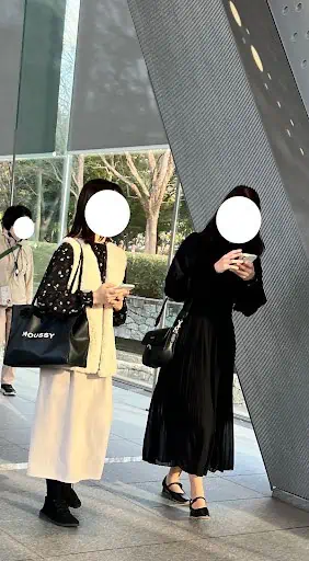 Two Women Dressed In A Line Skirts In Tokyo