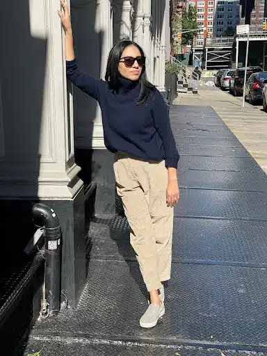 Woman dressed in turtleneck for business casual 