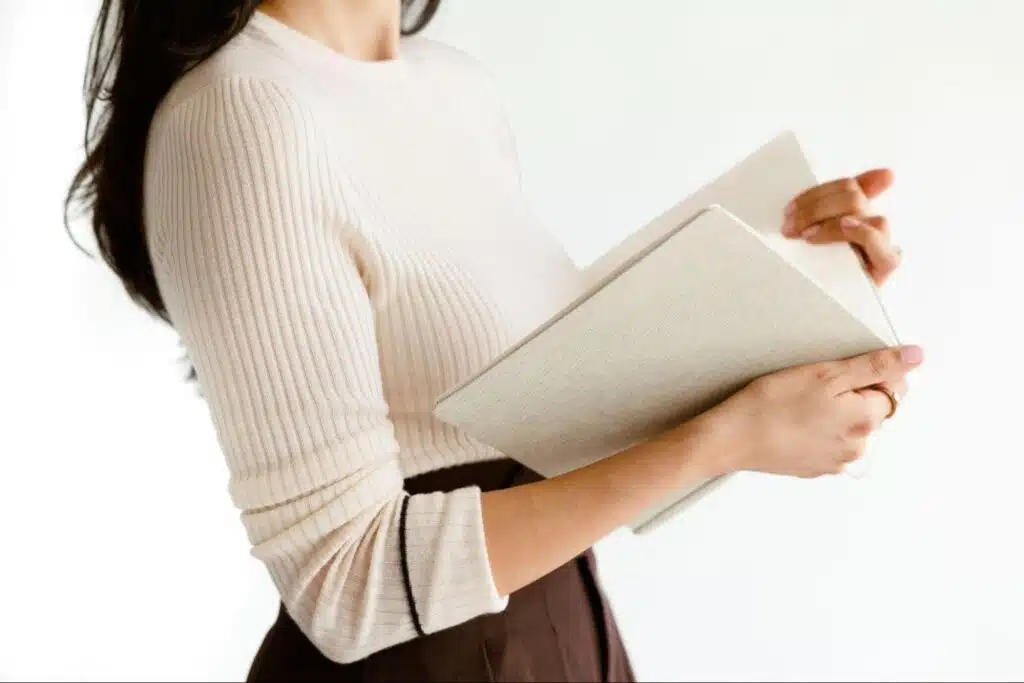 Personal stylist Cassandra Sethi holding a book.