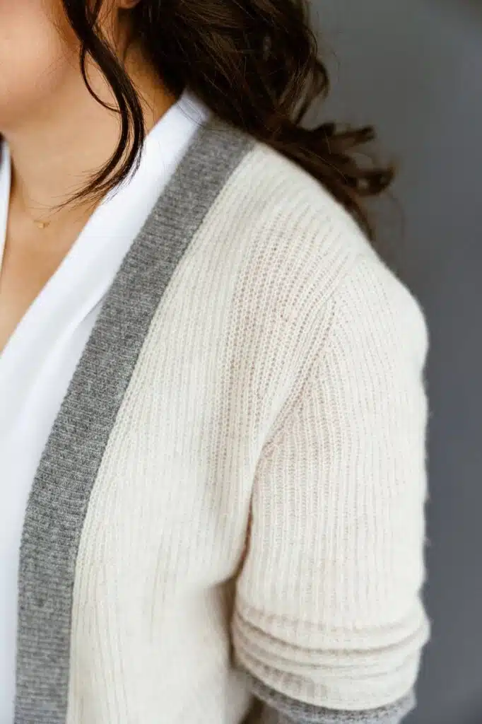 Mid-size body wearing a lightweight business casual cardigan sweater.