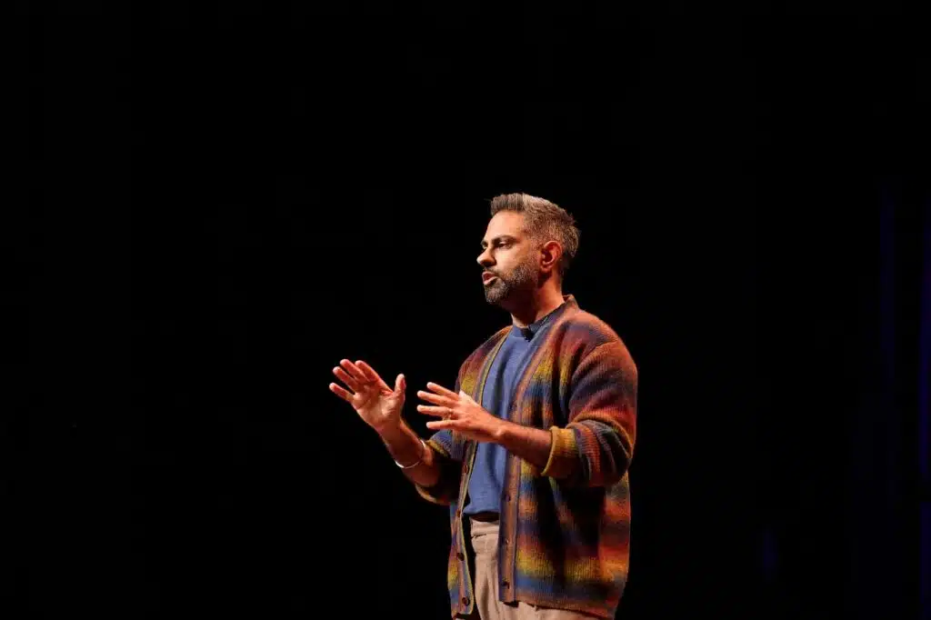 Image of Ramit Sethi in a multicolored cardigan.