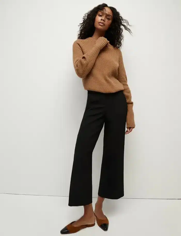 Image of a Family Law attorney wearing a casual sweater, tailored black trousers, and a closed-toe shoe in tan and black